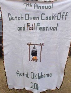 Handmade afghan showing a dutch oven over a fire, with the words "7th Annual Dutch Oven Cook-Off and Fall Festival, Avard, Oklahoma"