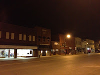 A Main Street full of businesses that are not open in the evening.