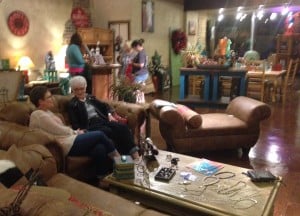 Shoppers at a furniture store find temporary displays of jewelry and skin care products.