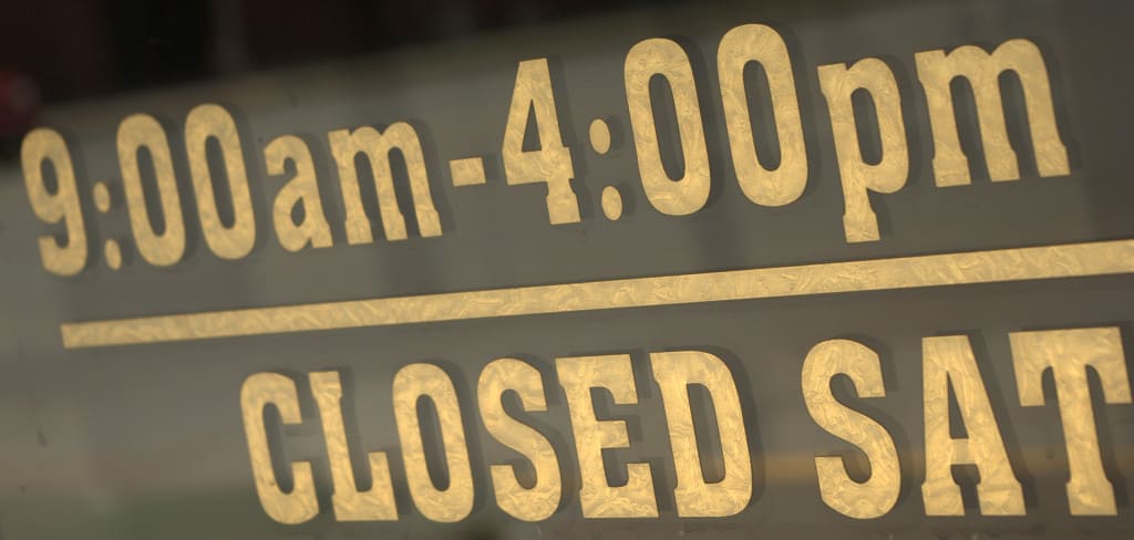 Sign says, "9 a.m. to 4 p.m. Closed Saturday."